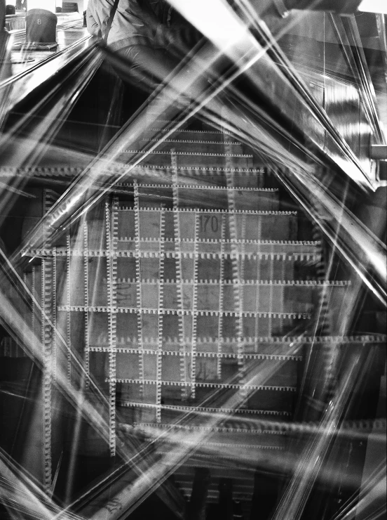 a black and white photo of a building, inspired by Germaine Krull, computer art, electronics see through, square shapes, 256435456k film, weaving