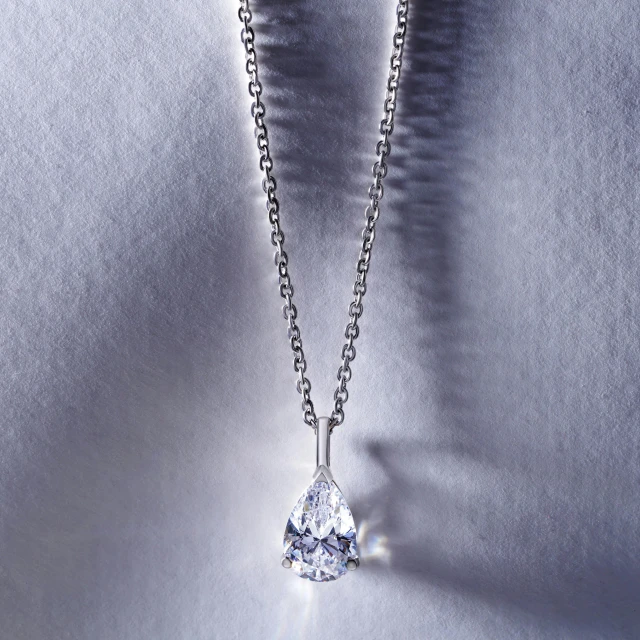 a close up of a necklace with a diamond on it, petite pear slim figure, environmental shot, swarovski, large