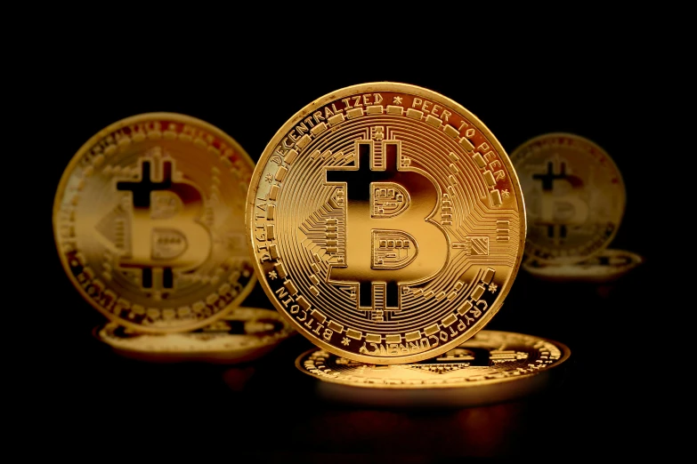 a group of golden bitcoins sitting on top of each other, with a black background, illustration », 1 petapixel image, background image