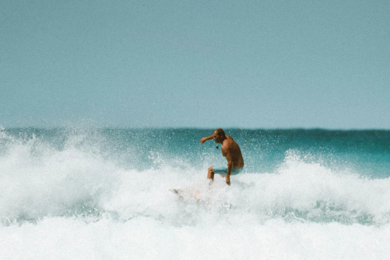 a man riding a wave on top of a surfboard, pexels contest winner, white beaches, profile image, cardboard, modelling