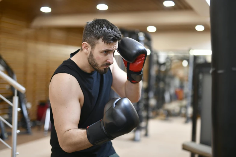 a man wearing boxing gloves in a gym, a portrait, pexels contest winner, figuration libre, thumbnail, no - text no - logo, profile image, image