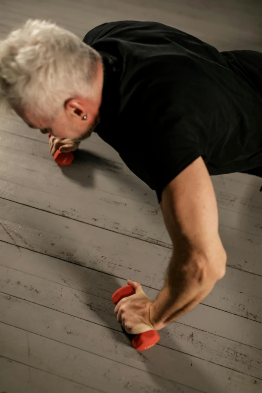 a man doing push ups on a wooden floor, inspired by Graham Forsythe, hyperrealism, holding hot sauce, profile image, stephen lang, fighting with angles