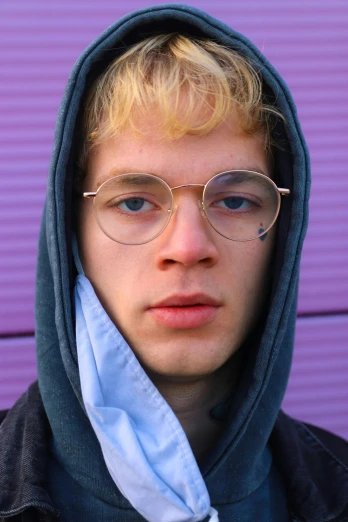a young man wearing glasses and a hoodie, featured on reddit, renaissance, honey - colored eyes, skydsgaard, high quality photo, a blond