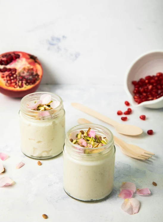 a couple of jars of food sitting on top of a table, a picture, cream, product shot, chiffon, full shot ( fs )