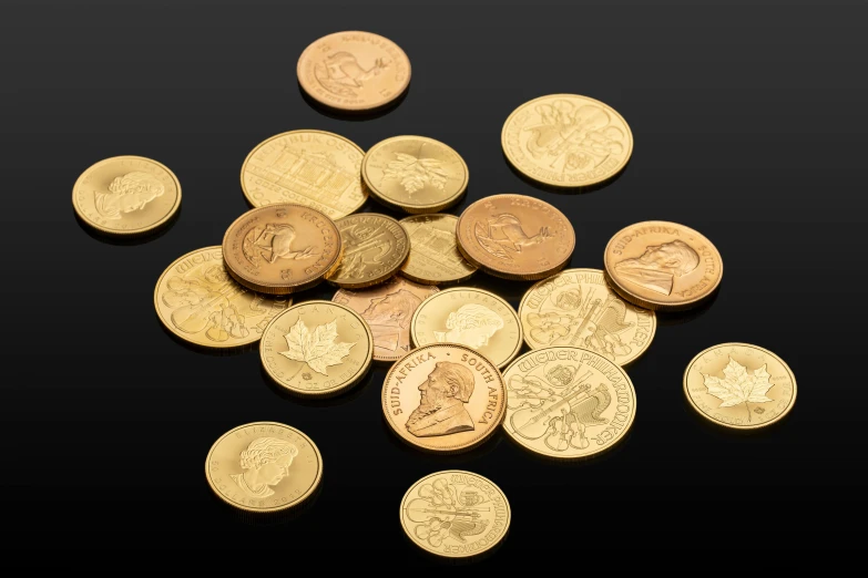 a pile of coins sitting on top of a table, in front of a black background, product photograph, golden miniatures, taken from the high street