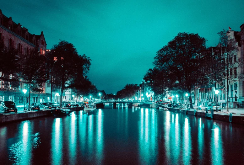 a canal in the middle of a city at night, by Jacob Toorenvliet, glowing hue of teal, profile picture 1024px, photographic, fine art print