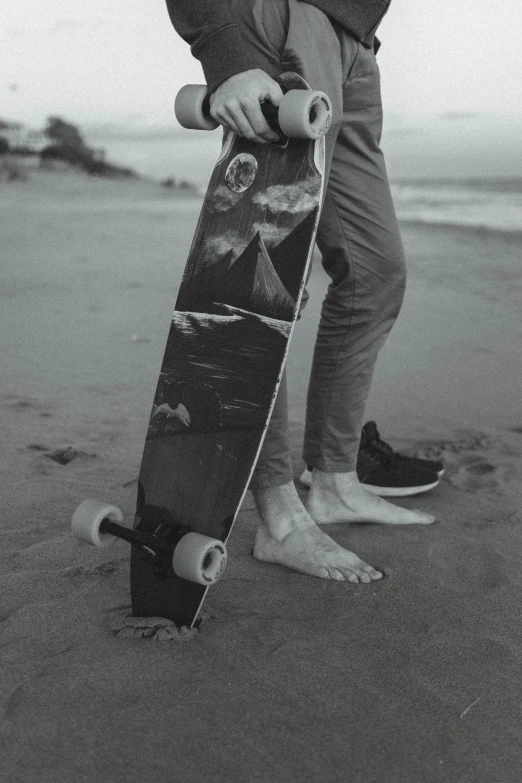 a black and white photo of a person holding a skateboard, beach pic, exposed toes, ilustration, gray canvas