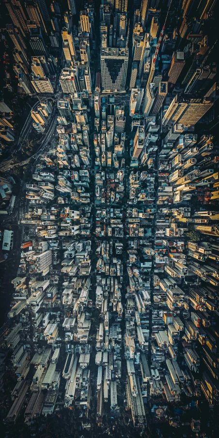 an aerial view of a city at night, an album cover, by Adam Marczyński, unsplash contest winner, hong kong buildings, highly microdetailed, tall thin build, instagram photo