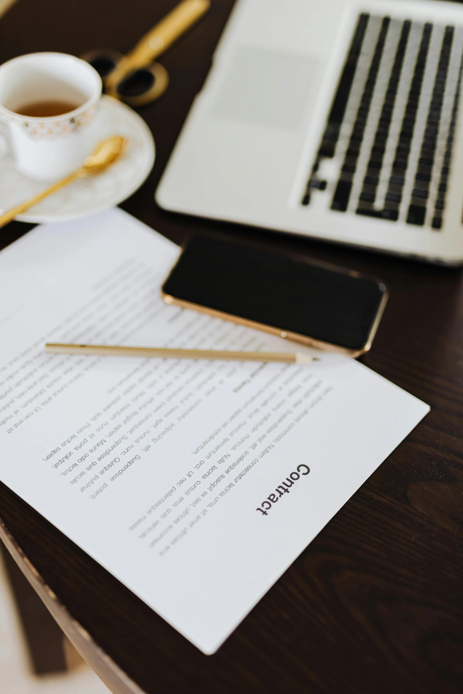 a laptop computer sitting on top of a wooden table, by Dan Content, unsplash contest winner, signing a bill, on vellum, taken on iphone 14 pro, behance lemanoosh