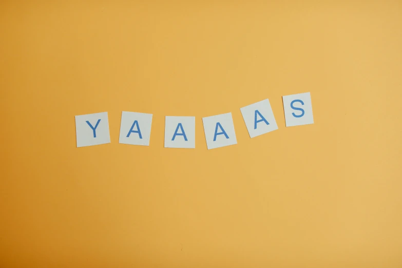 a piece of paper with the word yaaa written on it, unsplash, dada, yellow backdrop, laughing hysterically, squares, blues