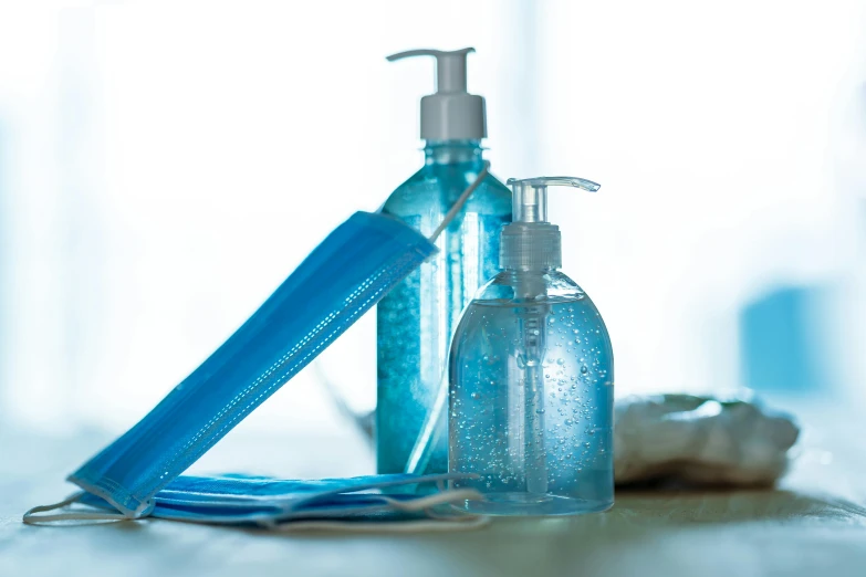 a close up of a bottle of liquid next to a toothbrush, pexels, plasticien, blue gloves, avatar image, face mask, square