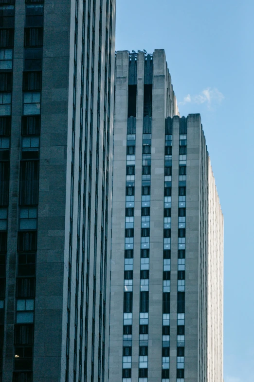 a couple of tall buildings sitting next to each other, by Doug Ohlson, unsplash, art deco architecture, toronto, superior detail, zoomed out shot