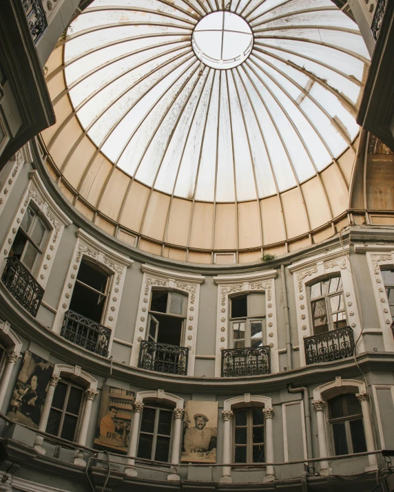 a building with a skylight in the middle of it, inside a dome, buenos aires, regal aesthetic, grey