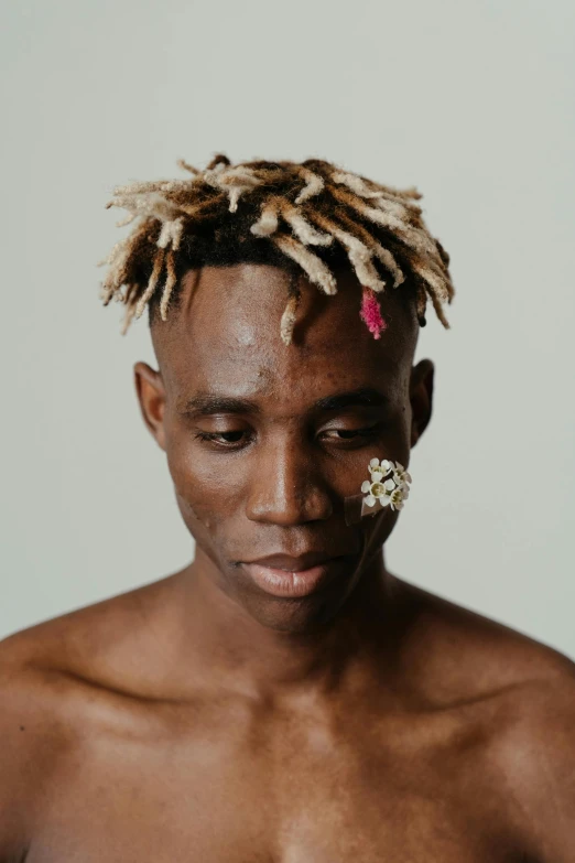 a shirtless man with dreadlocks on his head, an album cover, inspired by Barthélemy Menn, trending on pexels, hyperrealism, with white streak in hair, lostus flowers, ashteroth, wrinkled skin