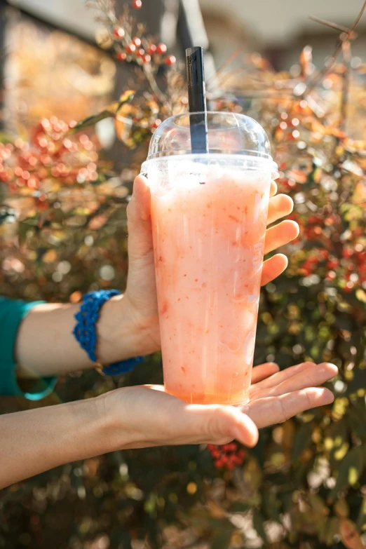 a person holding a drink in their hand, 🎀 🧟 🍓 🧚, slush!!, alabama, longque chen