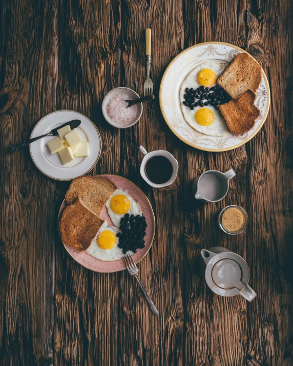 two plates of breakfast food on a wooden table, by Lucia Peka, pexels contest winner, dau-al-set, square, eggs, morning coffee, multiple stories