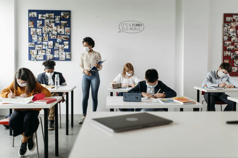 a group of people sitting at desks in a classroom, trending on pexels, ashcan school, standing on a desk, kids place, profile image, thumbnail