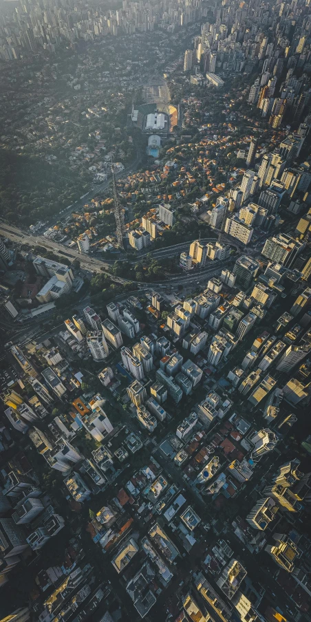 an aerial view of a city at dusk, an album cover, by Adam Marczyński, unsplash contest winner, são paulo, low detail, low iso, shenzhen