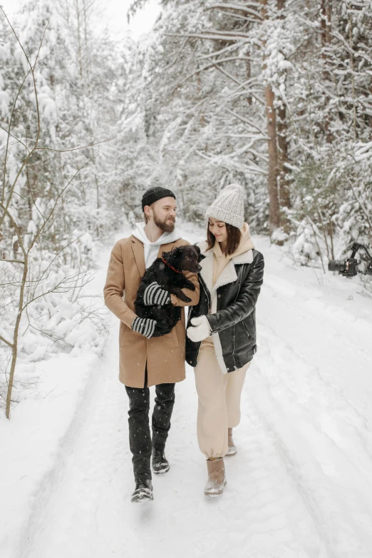 a man and woman walking in the snow with a dog, pexels contest winner, renaissance, straw hat and overcoat, gif, brunette, cottagecore