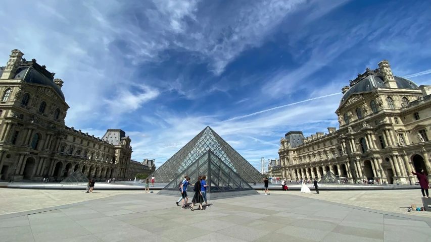 a group of people riding skateboards in front of a glass pyramid, french architecture, a wide open courtyard in an epic, slide show, photograph taken in 2 0 2 0