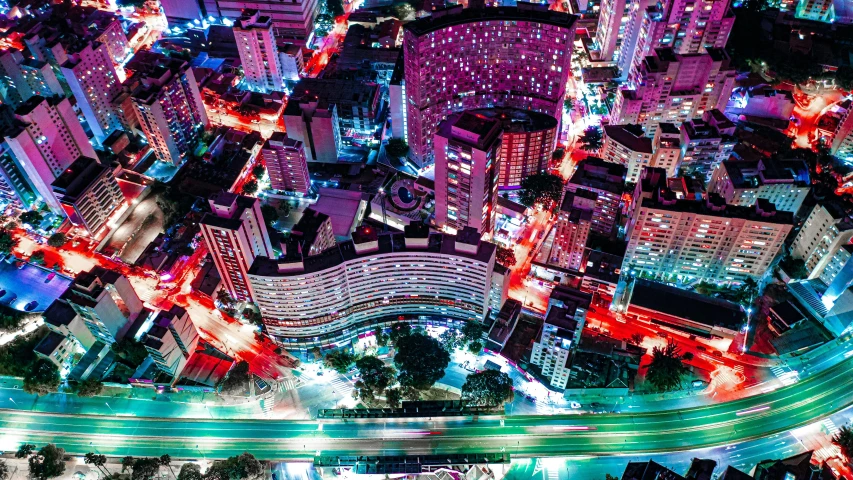 an aerial view of a city at night, by Felipe Seade, colorful buildings, futuristic sao paulo, instagram post, nightlife