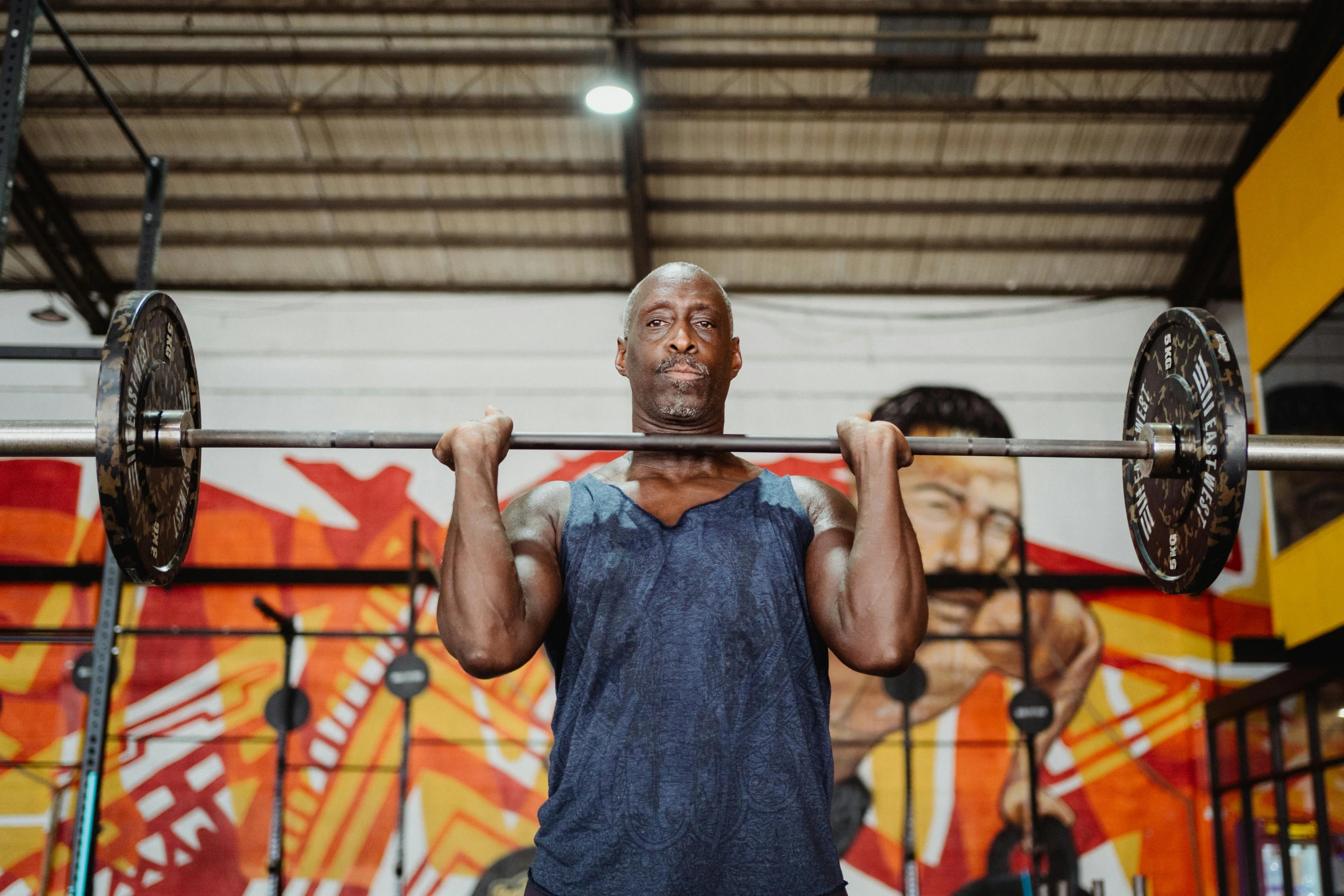 a man lifting a barbell in a gym, a portrait, by Sam Charles, pexels contest winner, lance reddick, avatar image, 4 5 yo, background image