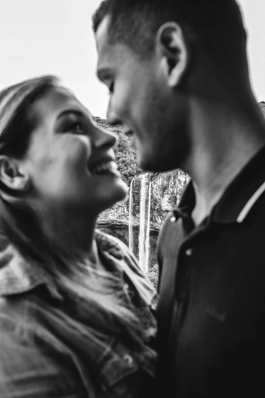 a black and white photo of a man and a woman, by Romain brook, flirting smiling, uploaded, profile image, smiling :: attractive