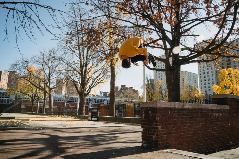 a man flying through the air while riding a skateboard, by Nina Hamnett, unsplash, ashcan school, flying trees and park items, humans of new york, bricks flying, in an urban setting
