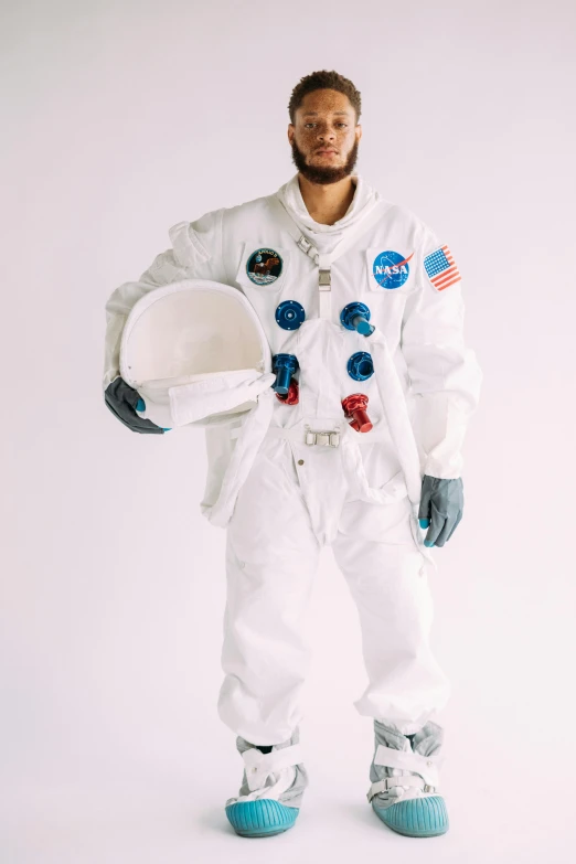 a man in an astronaut suit posing for a picture, a colorized photo, trending on unsplash, white background”, diverse costumes, white suit and hat, plain background