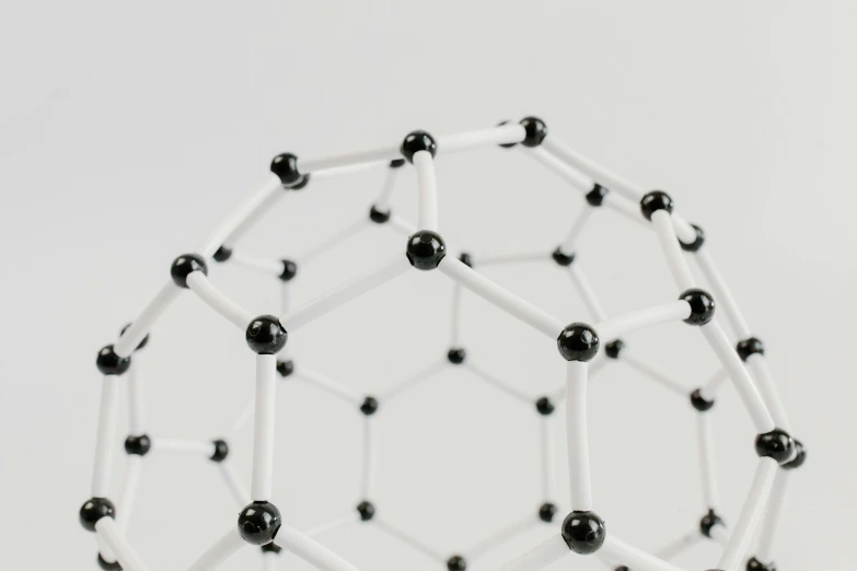 a black and white model of a hexagonal structure, unsplash, model of atom, encarpus, high quality material bssrdf, white background