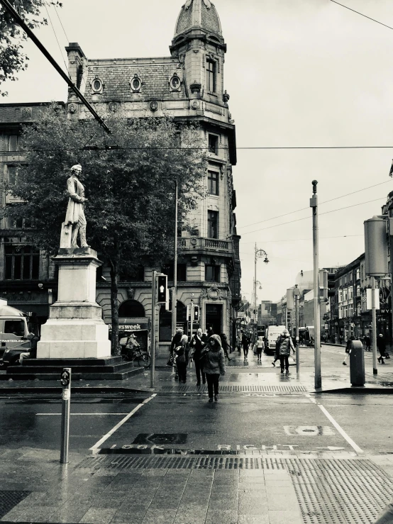 a black and white photo of a city street, by Daniel Seghers, pexels contest winner, renaissance, statue, rainy; 90's photograph, liege, iphone photo