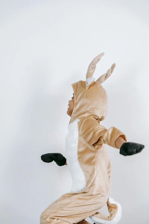a person in a costume jumping in the air, unsplash, subject : kangaroo, toddler, high quality image, pidgey