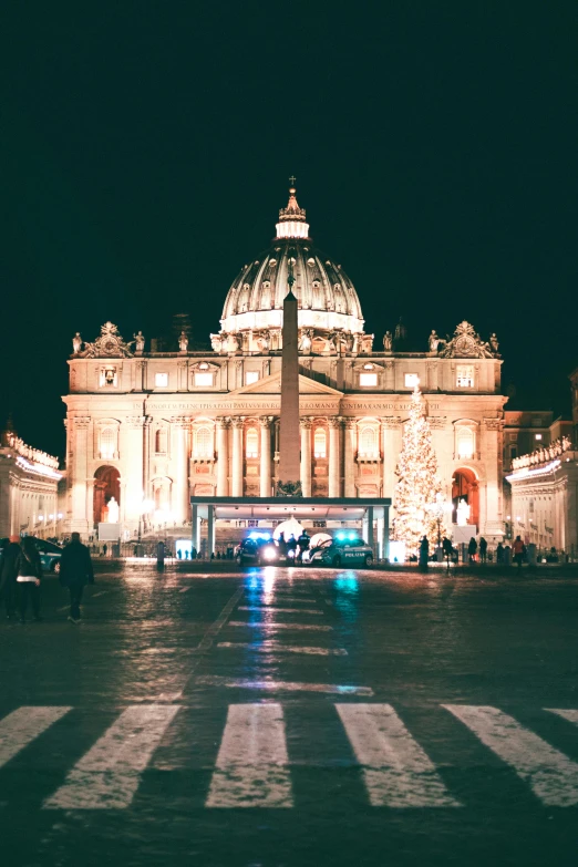 a large building that is lit up at night, inspired by Cagnaccio di San Pietro, pexels contest winner, promo image, seasonal, profile image, center of picture