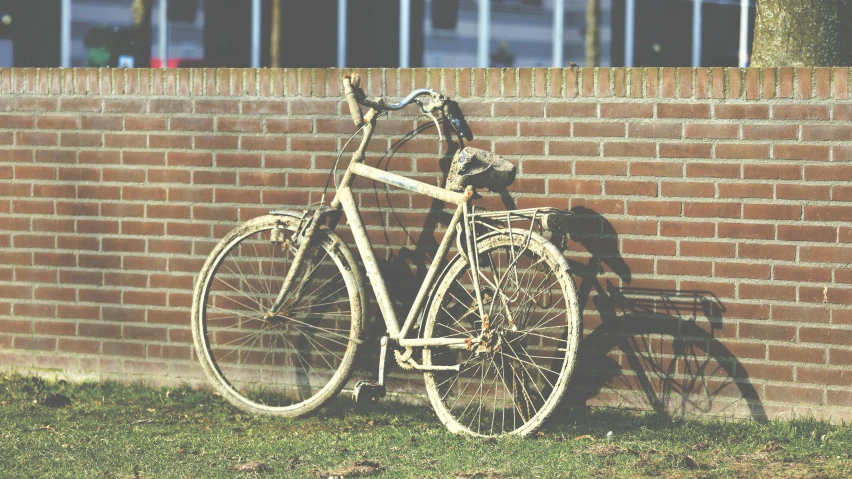 an old bicycle leaning against a brick wall, by Jan Tengnagel, pexels contest winner, brown and cream color scheme, crashed, background image, schools