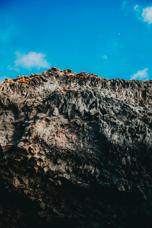 a man flying through the air while riding a snowboard, a screenshot, trending on unsplash, baroque, igneous rock materials, reunion island landscape, looking threatening, today\'s featured photograph 4k