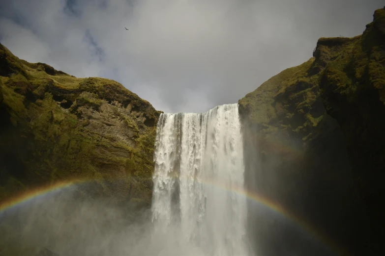 a rainbow shines in front of a waterfall, pexels contest winner, hurufiyya, ultrawide lens”, grey, ancient majestic, fujifilm”