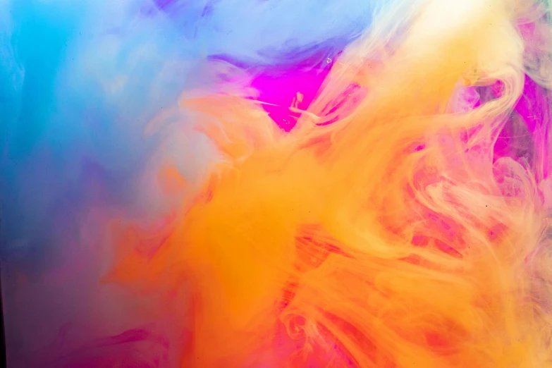 a close up of a cell phone on a table, trending on pexels, abstract expressionism, brightly coloured smoke, multicoloured, orange yellow ethereal, abstract liquid