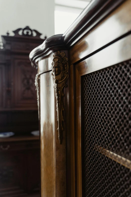 a wooden bed sitting in a bedroom next to a dresser, an album cover, by Adam Marczyński, unsplash, baroque, high - intricate - detail, close up shot from the side, cabinets, vents