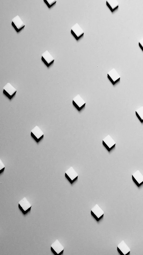 a black and white photo of a wall with squares, inspired by Malevich, unsplash, computer art, tiny stars, white steel, isometric, square