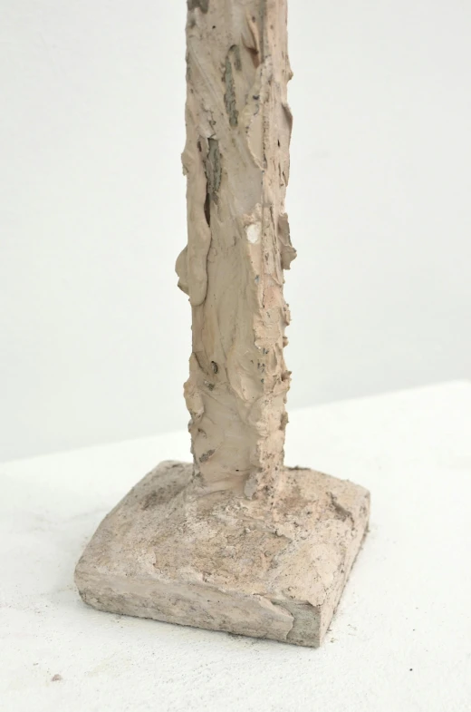 a close up of a sculpture on a white surface, by Alberto Giacometti, new sculpture, ceramic base, birch, tall thin, extra detail