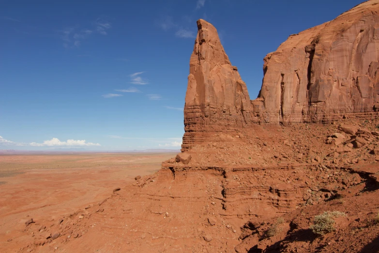 a large rock formation in the middle of a desert, by Jessie Algie, pexels contest winner, monument valley, avatar image, high elevation, panels