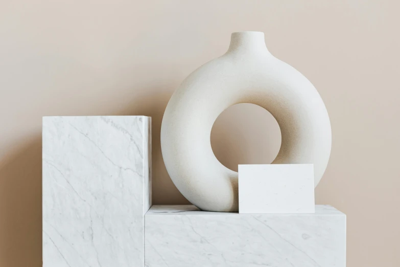 a white vase sitting on top of a marble block, a marble sculpture, minimalism, enso, morandi colour scheme, detailed product image, light source from the left