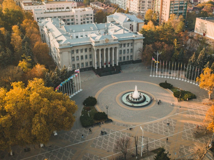 a large white building with a fountain in front of it, a tilt shift photo, pexels contest winner, socialist realism, autumn season, wide high angle view, neo kyiv, 000 — википедия