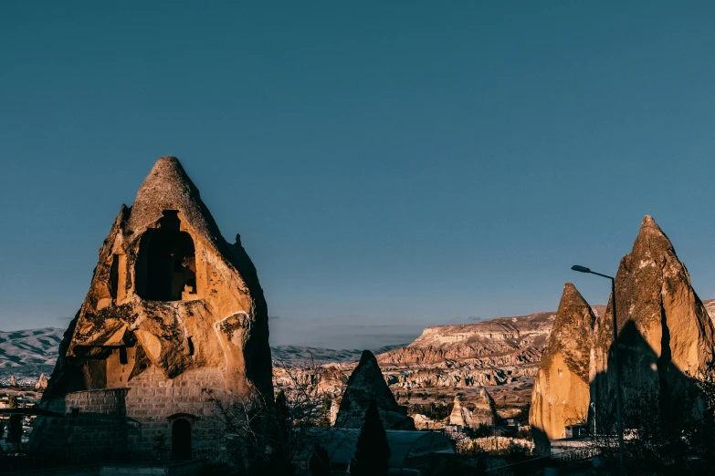 a group of rocks sitting on top of a hill, pexels contest winner, baroque, dry archways and spires, turkey, background image, unsplash photography