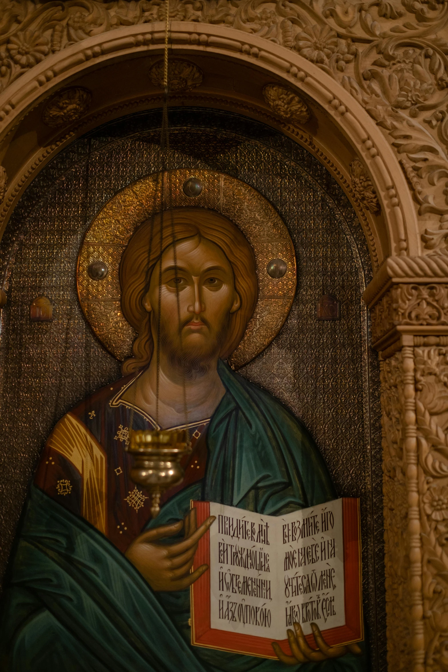 a painting of jesus reading a book in a church, trending on unsplash, cloisonnism, damascus, looking the camera, ornate carved architecture, 2019 trending photo