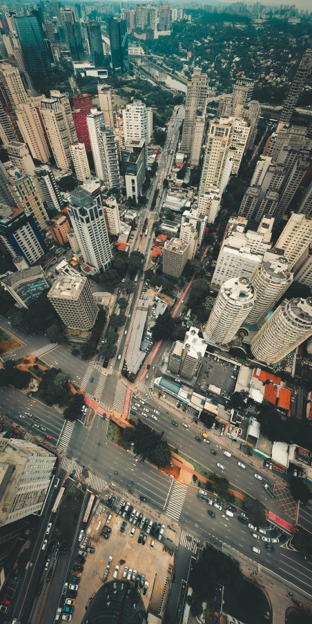 an aerial view of a city with tall buildings, an album cover, pexels contest winner, intersection, thumbnail, hd footage, diverse