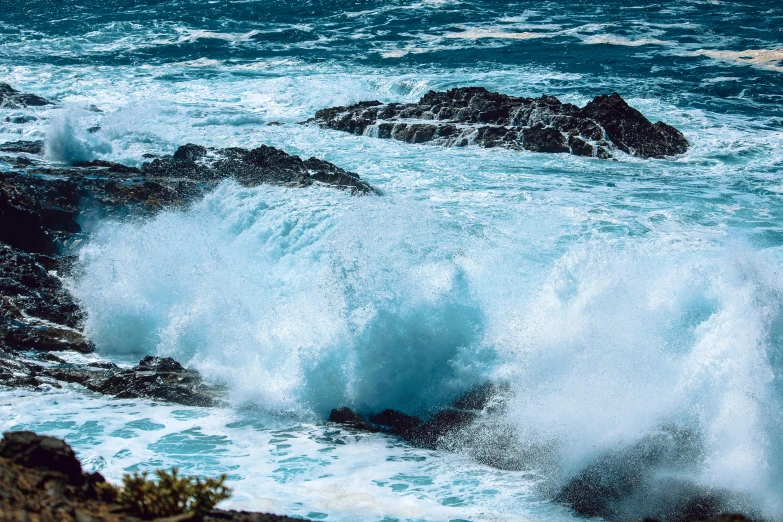 a person riding a surfboard on top of a wave, pexels contest winner, waves crashing at rocks, thumbnail, blue, australian beach