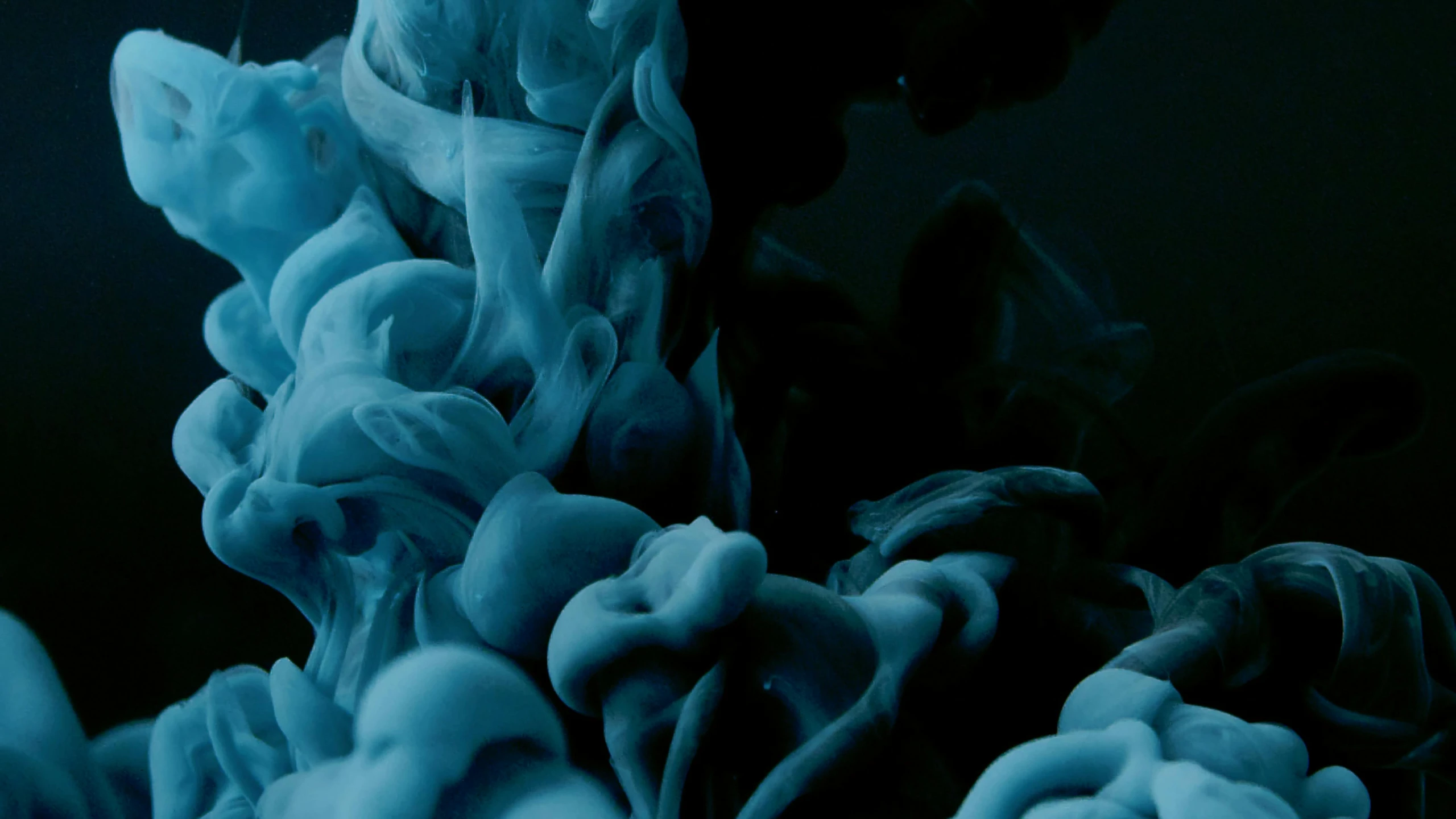 a close up of a blue substance in water, inspired by Kim Keever, unsplash contest winner, dark ink, 2 0 2 1 cinematic 4 k framegrab, photographed on colour film, stylized illustration