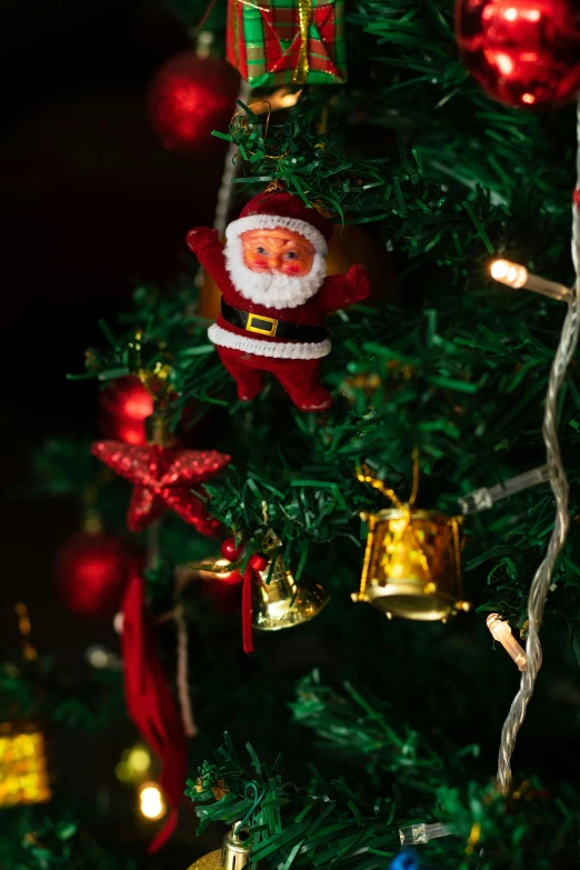 a close up of a christmas tree with ornaments, sitting on santa, nostalgic lighting, mini model, zoomed in