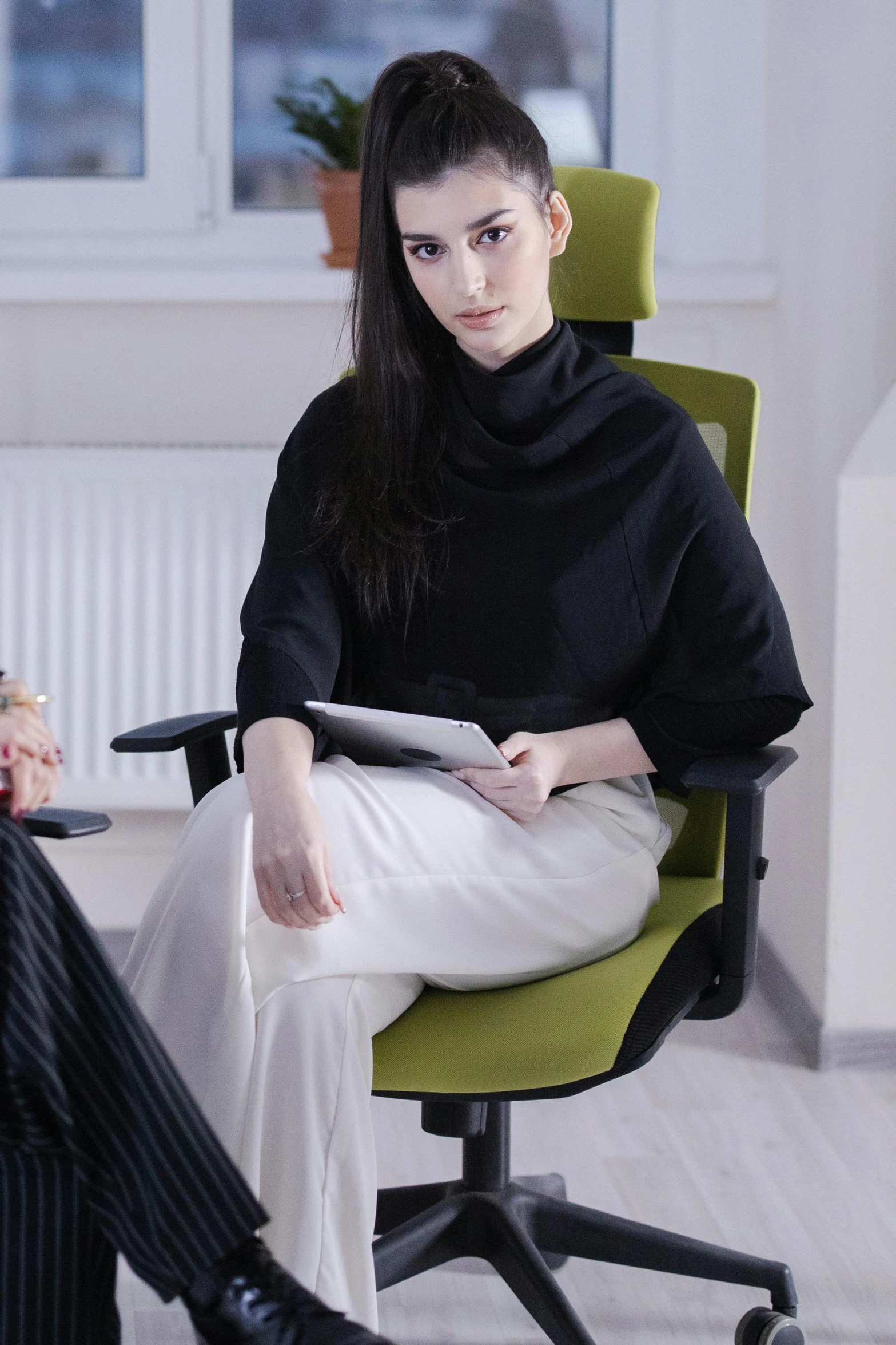 a woman sitting in a chair talking to another woman, inspired by Marina Abramović, pexels contest winner, renaissance, wearing business casual dress, amouranth as a super villain, office furniture, high collar